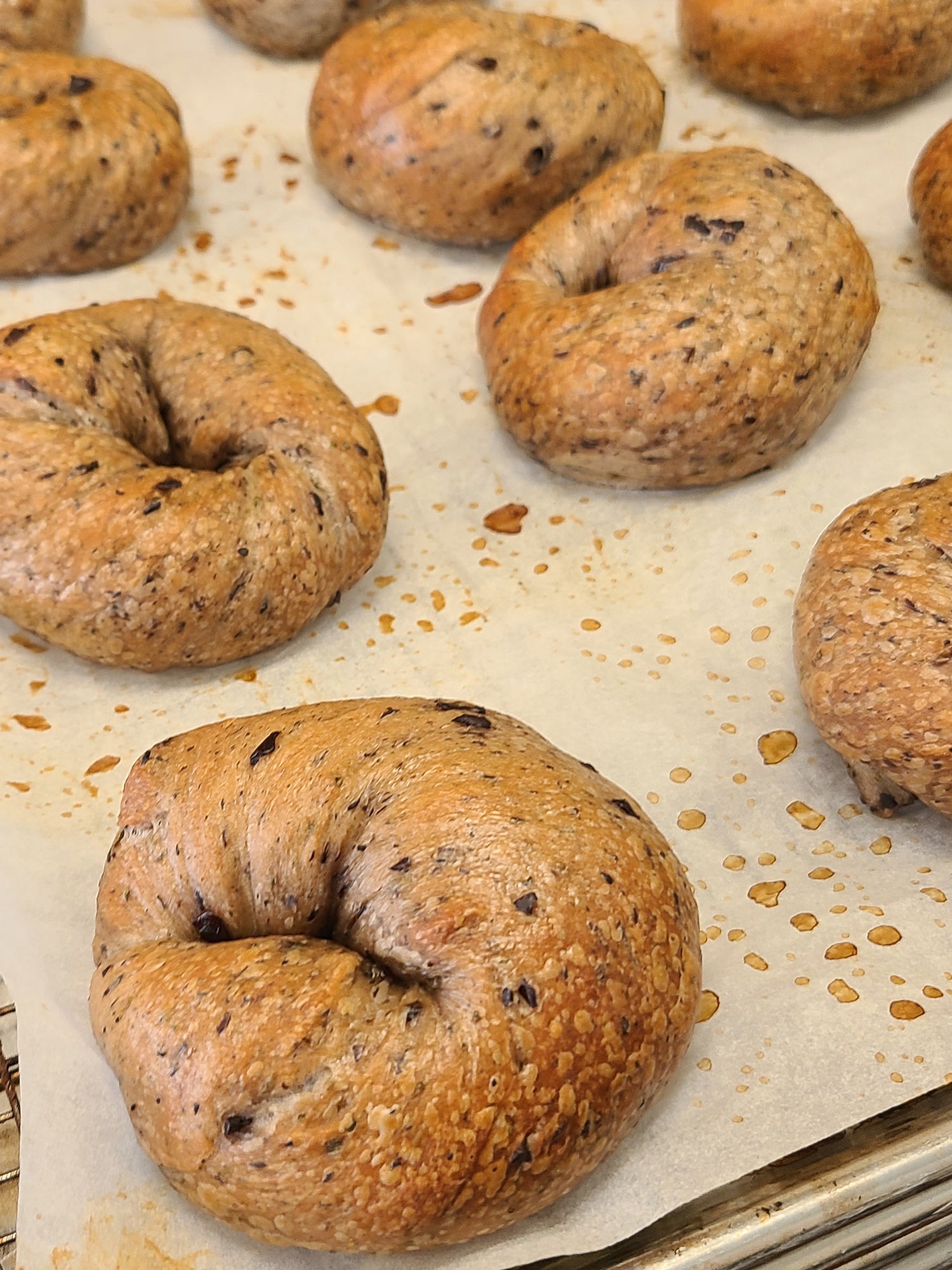 Bagels on a baking tray with parchment paper